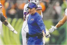  ?? MICHAEL REAVES/GETTY IMAGES FILES ?? Buffalo head coach Sean McDermott, centre, has led the Bills to their first two playoff berths of the century.