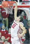  ?? ASSOCIATED PRESS ?? UW sophomore Ethan Happ ends up with 12 points and 12 boards.