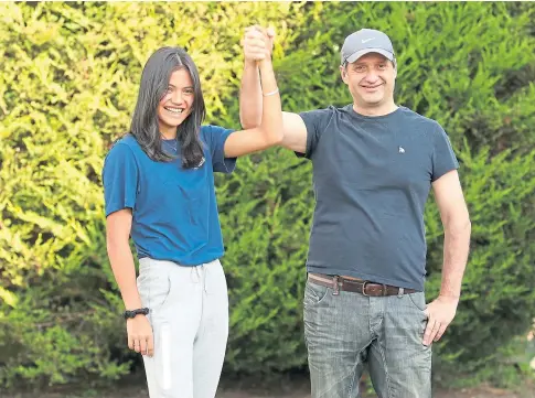  ??  ?? HOME COMFORT: Emma Raducanu is back with her family after her sensationa­l US Open victory in New York.