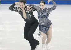  ?? THE ASSOCIATED PRESS ?? Scott Moir and Tessa Virtue perform their short dance on Thursday at the ISU Grand Prix Final in Nagoya, Japan. The world champs from Canada are second headed into Saturday’s free dance.