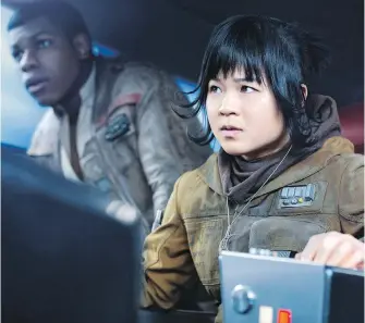  ??  ?? Kelly Marie Tran as Rose and John Boyega as Finn in Star Wars: The Last Jedi.