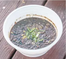  ?? NICK KOZAK PHOTOS FOR THE TORONTO STAR ?? Dinuguan, a Filipino stew made from offal and pork blood, at Kanto by Tita Flips.