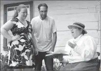  ?? PETER LEE, RECORD STAFF ?? Doon Heritage Village’s Carolyn Blackstock, right, with Brandy, left, and Chris Gillner, in front of author Peter McArthur’s home.