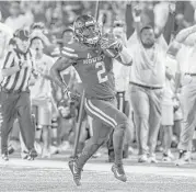  ?? Joe Buvid ?? Running back Duke Catalon is off to the races as he goes 52 yards for one of his two touchdowns in the third quarter of the Cougars’ victory over SMU.