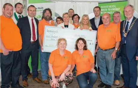  ??  ?? BELOW: The Duleek Fair Day group accept their funding from the MCC/Indaver fund.