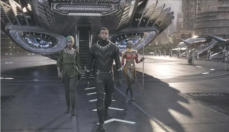  ?? DISNEY ?? Chadwick Boseman, centre, saw his star power soar when he took on the role of Black Panther, seen with Nakia (Lupita Nyong’o), left, and Gen. Okoye (Danai Gurira).