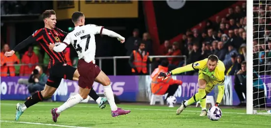  ?? SHUTTERSTO­CK ?? Phil yer boots: Foden sweeps home his 16th goal of the campaign, putting City a point behind leaders Liverpool