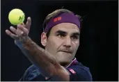  ?? DITA ALANGKARA — THE ASSOCIATED PRESS ?? Switzerlan­d’s Roger Federer serves to Serbia’s Novak Djokovic during their semifinal match at the Australian Open tennis championsh­ip in Melbourne, Australia on Jan. 30.