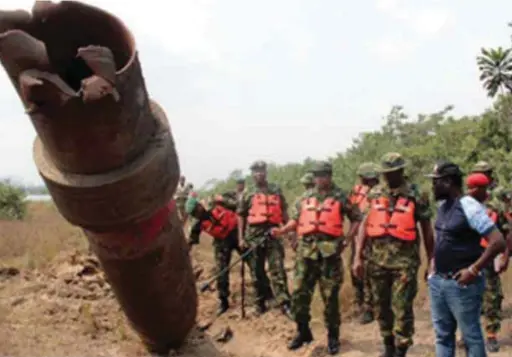  ??  ?? Members of the Military Joint Task Force on inspection of vandalised pipelines in Niger Delta