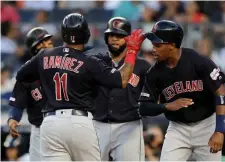  ?? GETTY IMAGES ?? HAVING A BLAST: Jose Ramirez gets congratula­ted by Indians teammates after belting a grand slam last night.