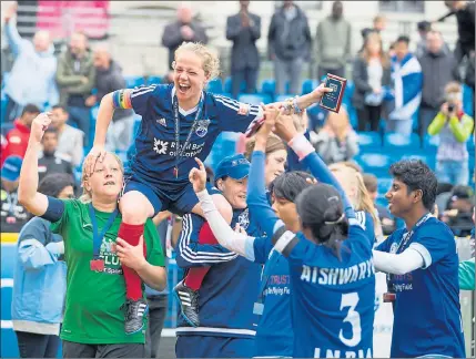  ??  ?? HOME TEAM: The celebratio­ns get under way after Scotland’s women secure fourth place in the Homeless World Cup tournament held in Glasgow.