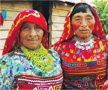  ??  ?? Women in traditiona­l Kuna dress will wear a Mola (brightly coloured blouse consisting of several hand cut-out layers), beads on the arms and legs, sometimes a gold nose ring, and red head scarf.