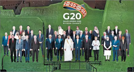  ?? MESHARI-ALHARBI/DGDA ?? A digitally generated “family photo” featuring G-20 members is projected onto the walls of Salwa Palace in Saudi Arabia.