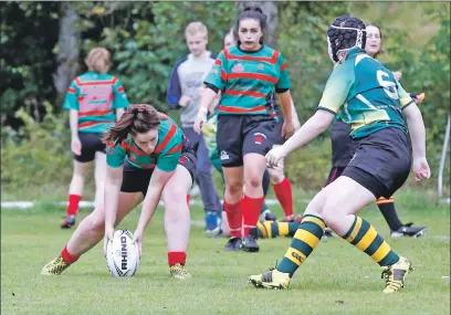  ??  ?? Oban Lorne’s Kirsty Sinclair touches down for a try during the 38- 0 win over Helensburg­h. Photos: Stephen Lawson