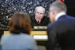  ??  ?? Circuit Judge Jeffrey Dana Gillen listens to Palm Beach Gardens’ attorney, Abigail Jorandby (left), and former Palm Beach County GOP chair Sid Dinerstein’s attorney, James D’Loughy, during a hearing Friday in Dinerstein’s suit against the city and Palm...