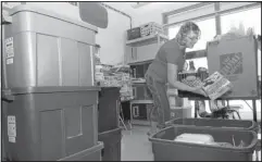  ?? JIM THOMPSON/JOURNAL ?? Lisa Reed, a second-grade teacher at Enchanted Hills Elementary, unpacks boxes in preparatio­n for the first day of school on Aug. 20.