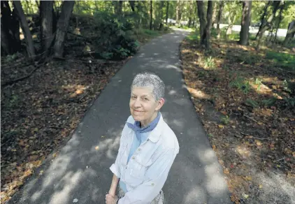  ?? JONATHON GRUENKE/STAFF ?? Tyla Matteson, standing on the Matteson Trail, gave the city of Hampton $10,000 to maintain the trail, which bears her mother’s name.