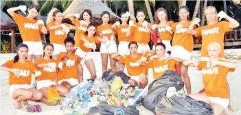  ??  ?? The 16 contestant­s of the Miss Scuba Internatio­nal contestant­s cleaned the beach at Mabul Island as part of marine conservati­on efforts.They had also attended video and photo shooting sessions before the final at Magellan Resort in Kota Kinabalu on...