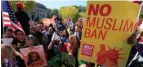  ?? (Photo by Manuel Balce Ceneta, AP, File) ?? In this Oct. 18, 2017, file photo, protesters gather at a rally in Washington. The Supreme Court is allowing the Trump administra­tion to fully enforce a ban on travel to the United States by residents of six mostly Muslim countries. The justices say in...