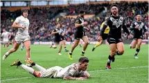  ?? GETTY IMAGES ?? Oliver Gildart scores his superb solo try for England that proved to be the difference between the two teams.