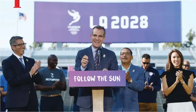  ?? —AFP ?? CARSON: Los Angeles Mayor Eric Garcetti speaks at the podium as he announces a deal has been reached with the Internatio­nal Olympic Committee to host the 2028 Summer Olympics during a news conference with LA 2024 Bid Chairman Casey Wasserman (L) City...