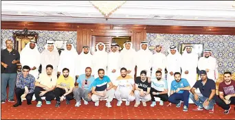  ??  ?? Members of organizing committee for 1st indoor soccer tournament of cooperativ­e societies in Ahmadi Governorat­e
in a group photo.