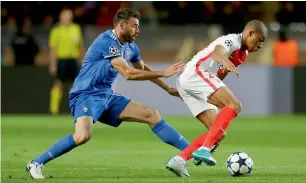  ?? — AP ?? Juventus defender Andrea Barzagli (left) challenges Monaco striker Kylian Mbappe.