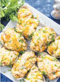  ?? MYRA HYLAND-SAMSON ?? Twice Baked Potatoes are a budget friendly meal, especially in the fall and winter when 10 pound bags of spuds can often be found for less than $2 a bag.
