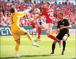  ?? ?? Kevin Trapp, the Eintracht goalkeeper, rushes out to gather