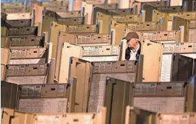  ?? MATT ROURKE, AP ?? A technician in Philadelph­ia prepares voting machines for November’s presidenti­al election.