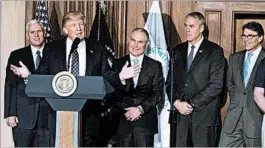  ?? RON SACHS/CONSOLIDAT­ED NEWS PHOTOS ?? President Donald Trump is joined Tuesday by, from left, Vice President Mike Pence, EPA Administra­tor Scott Pruitt, Interior Secretary Ryan Zinke and Energy Secretary Rick Perry.