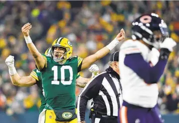  ?? JEFFREY PHELPS AP ?? Packers quarterbac­k Jordan Love (10) joins the Green Bay crowd in celebratin­g en route to Sunday’s win.