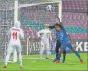  ?? AFC ?? India’s Sandhiya Ranganatha­n challenges Iranian goalkeeper Zohreh Koudaei for the ball during their match on Thursday.