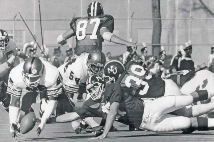  ?? SUN-TIMES ?? Keena Turner (left), recovering a fumble for Purdue against Northweste­rn in 1977, didn’t seriously consider playing pro football until college. The 49ers selected him in the second round of the 1980 draft.