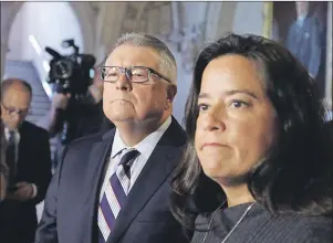  ?? CP PHOTO ?? Ralph Goodale, Minister of Public Safety and Emergency Preparedne­ss, and Jody Wilson-Raybould, Minister of Justice and Attorney General of Canada, hold a news conference regarding a $10.5 millon payment to Omar Khadr on Parliament Hill in Ottawa Friday.