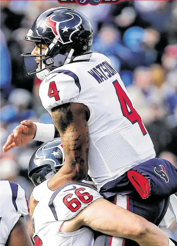  ?? Brett Coomer / Staff photograph­er ?? Deshaun Watson leaps into the arms of Nick Martin after the first of Watson’s two first-half touchdown passes to Kenny Stills on Sunday against Tennessee.