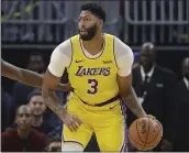  ?? JEFF CHIU —THE ASSOCIATED PRESS ?? The Lakers’ Anthony Davis might not play against Golden State in Monday’s exhibition after suffering a thumb injury.