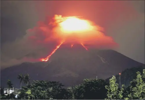  ??  ?? Lava cascades down the slopes of Mount Mayon volcano, as seen from Legazpi city, Albay province, 210 miles southeast of Manila, Philippine­s.