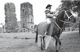  ?? ERIC BATISTA/AP ?? A man dressed as a colonial Spaniard rides a horse during activities Thursday celebratin­g the 500th anniversar­y of the founding of Panama City, near the ruins of Old Panama. The city was founded August 15, 1519, by Spanish conquistad­or Pedro Arias Davila.