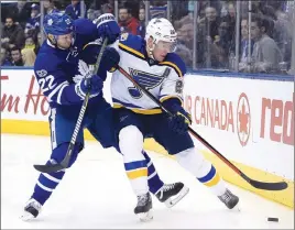  ?? CP PHOTO ?? St. Louis Blues centre Paul Stastny battles with Toronto Maple Leafs defenceman Nikita Zaitsev for the puck during a regular-season game. The Maple Leafs won’t have Zaitsev for Game 1 of their first-round playoff series against Washington.