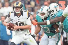  ?? GARY A. VASQUEZ, USA TODAY SPORTS ?? Jared Goff, left, was 17-for-31 for 134 yards vs. the Dolphins.