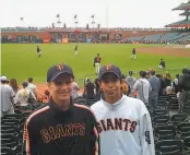  ?? Courtesy Ritchey family ?? Mauricio ( right), attends a Giants game with Ben Ritchey in 2010, at a park where he always dreamed of playing someday. And now he might.