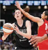  ?? Steph Chambers/Getty Images ?? The WNBA saw two super teams form this offseason as two-time MVP Candace Parker, left, signed with Las Vegas, the reigning champ, and Breanna Stewart, right, joined the New York Liberty as a free agent.