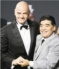  ?? — AP ?? ZURICH: Gianni Infantino, left, FIFA President, and Diego Armando Maradona, a former Argentine footballer, pose for a photo on the green carpet while arriving for the The Best FIFA Football Awards 2016 ceremony in Zurich, Switzerlan­d, yesterday.
