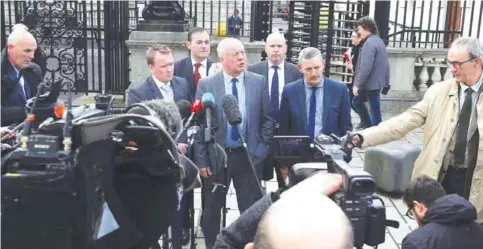  ?? AFP ?? BELFAST: Victims’ rights campaigner Raymond McCord (center) speaks to the media outside the High Court in Belfast yesterday after attending the ruling in a legal challenge against Brexit. —