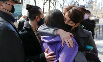  ?? ?? Family members embrace outside the courthouse in Toronto, after the verdict in the trial of Alek Minassian in March 2021. Photograph: Chris Helgren/Reuters