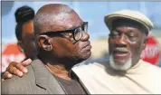  ?? GERALD HERBERT — THE ASSOCIATED PRESS ?? Wilbert Jones talks to media Wednesday with his brother Plem Jones, right, after leaving East Baton Rouge Parish Prison in Baton Rouge, La. A judge overturned Wilbert Jones’ conviction in the kidnapping and rape of a nurse.