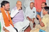  ?? — DC ?? BJP president Amit Shah is served tea during his doorto-door campaign in Nalgonda on Friday.