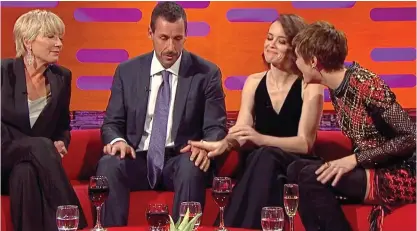  ??  ?? No thanks: The actress puts Sandler’s hand back on his own knee, still under Thompson’s gaze