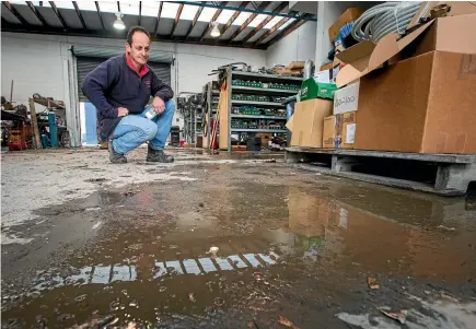  ?? PHOTO: PHOTO: MYTCHALL BRANSGROVE/STUFF ?? Plains Irrigators business in Washdyke was flooded last week, and technician Theo Joubert anticipate­s more time spent cleaning.